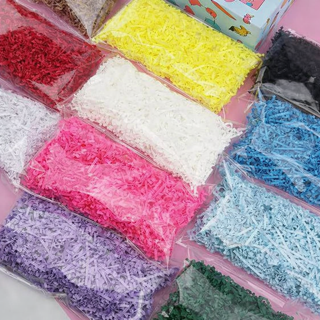Assorted bags of colorful crinkle paper filler