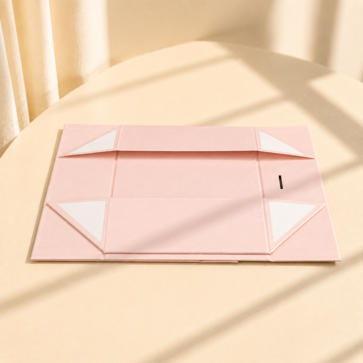 Pink collapsible magnetic gift box shown flat before assembly