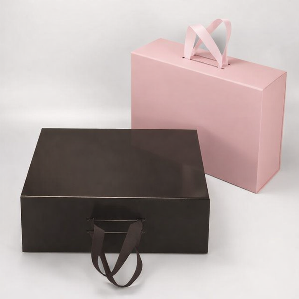 Foldable gift box with ribbon tie closure