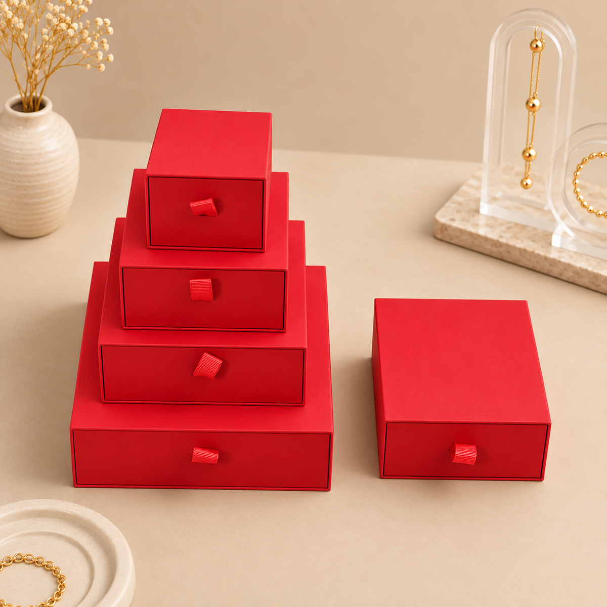 Red paper drawer jewelry boxes shown in the five size options