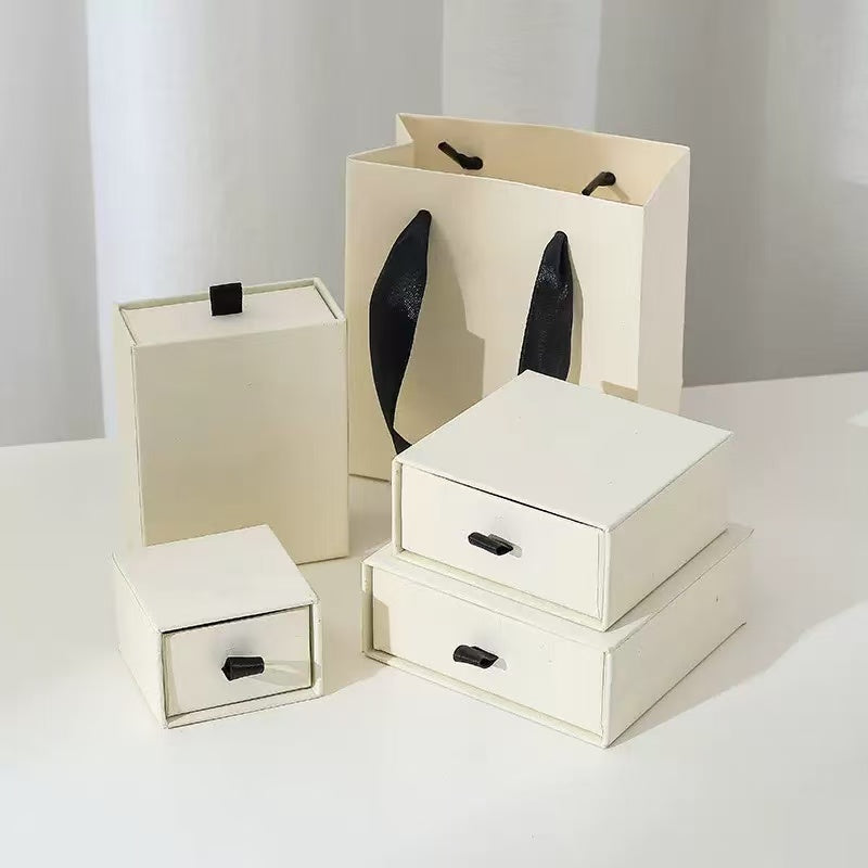 Sliding drawer rigid gift box showing the outer sleeve and tray