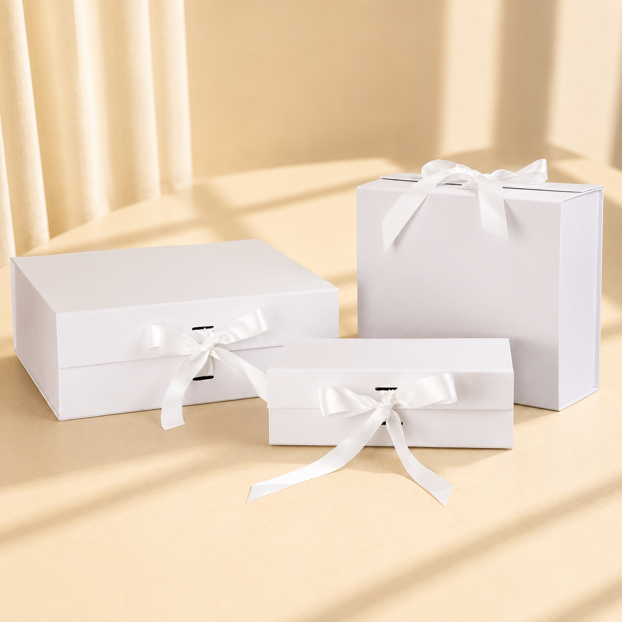 White ribbon gift boxes with matching handled gift box