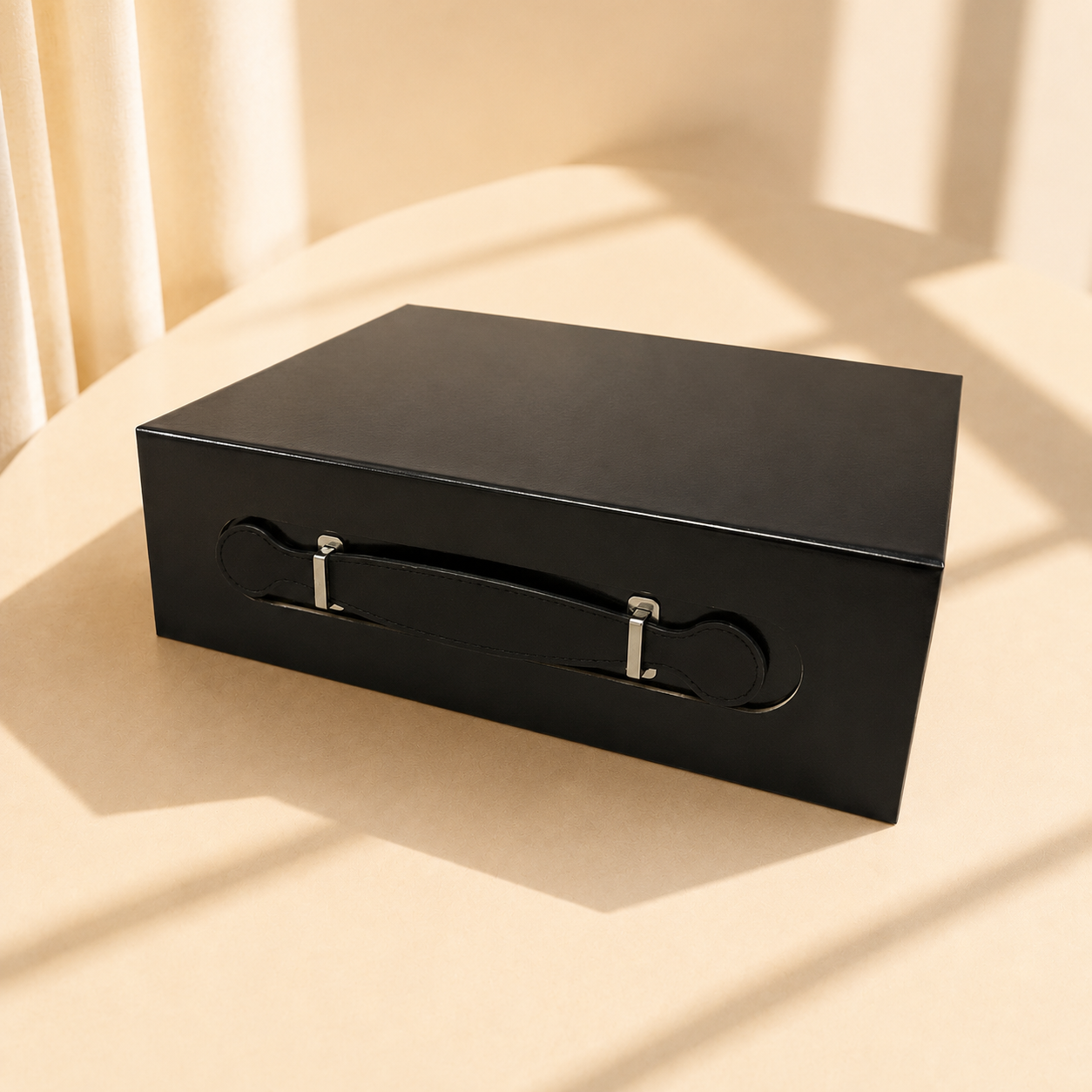 Black handled folding gift box with ribbon carrying handles