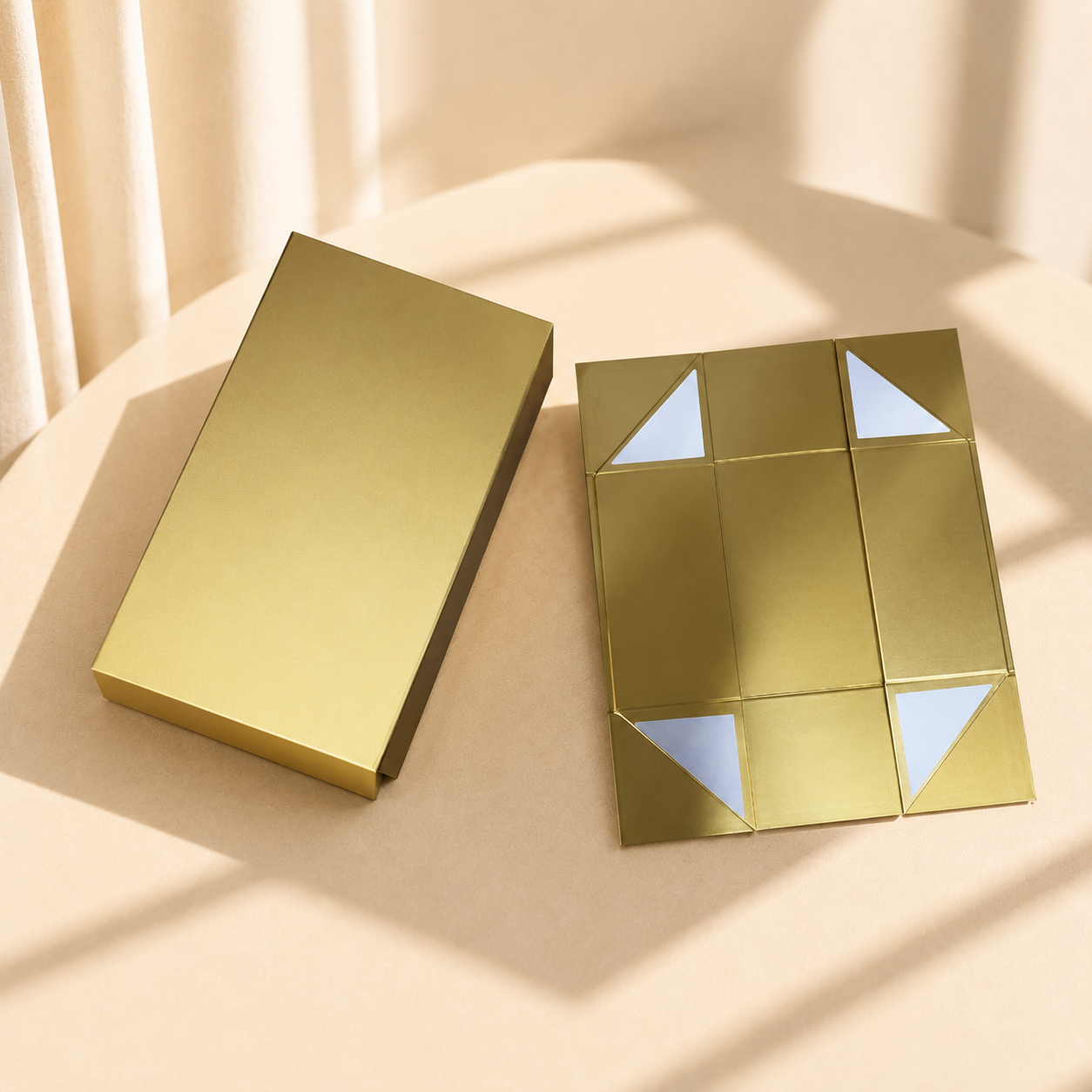 Gold collapsible magnetic gift box shown closed and flat