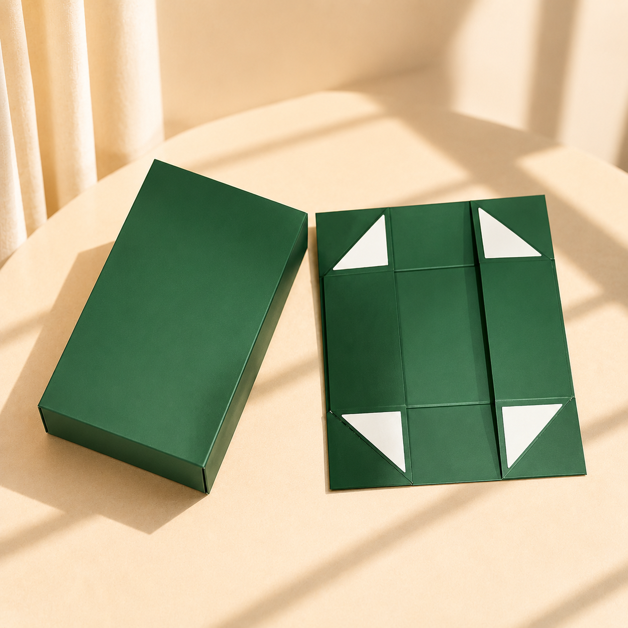 Green collapsible magnetic gift box shown closed and flat