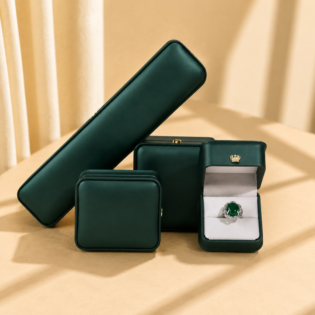 Dark green crown-shaped jewelry boxes in assorted formats