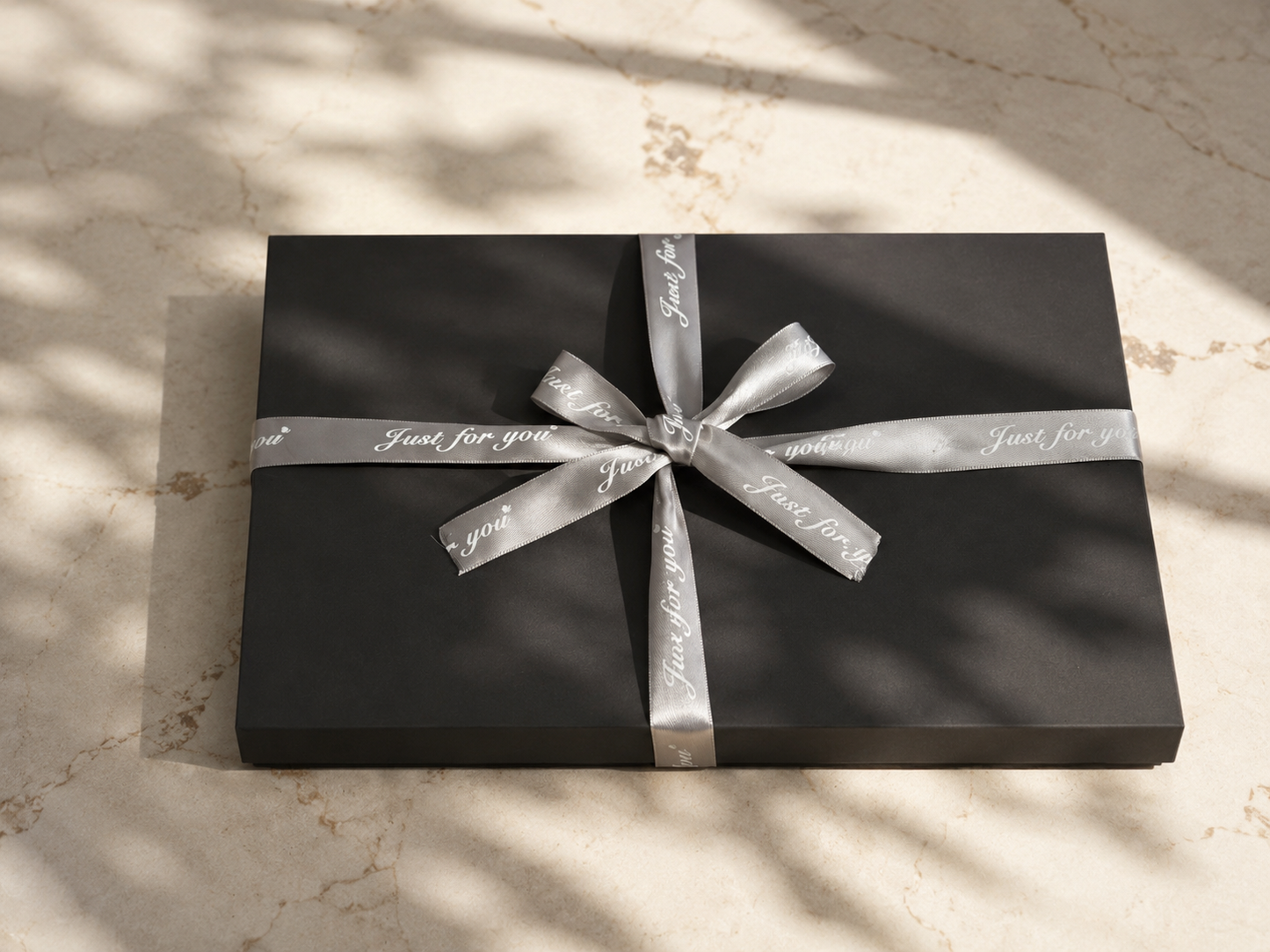 Unboxing presentation of a high-end gray cardboard gift box with soft interior lining padding, designed for high-end stationery and tech gadget packaging.