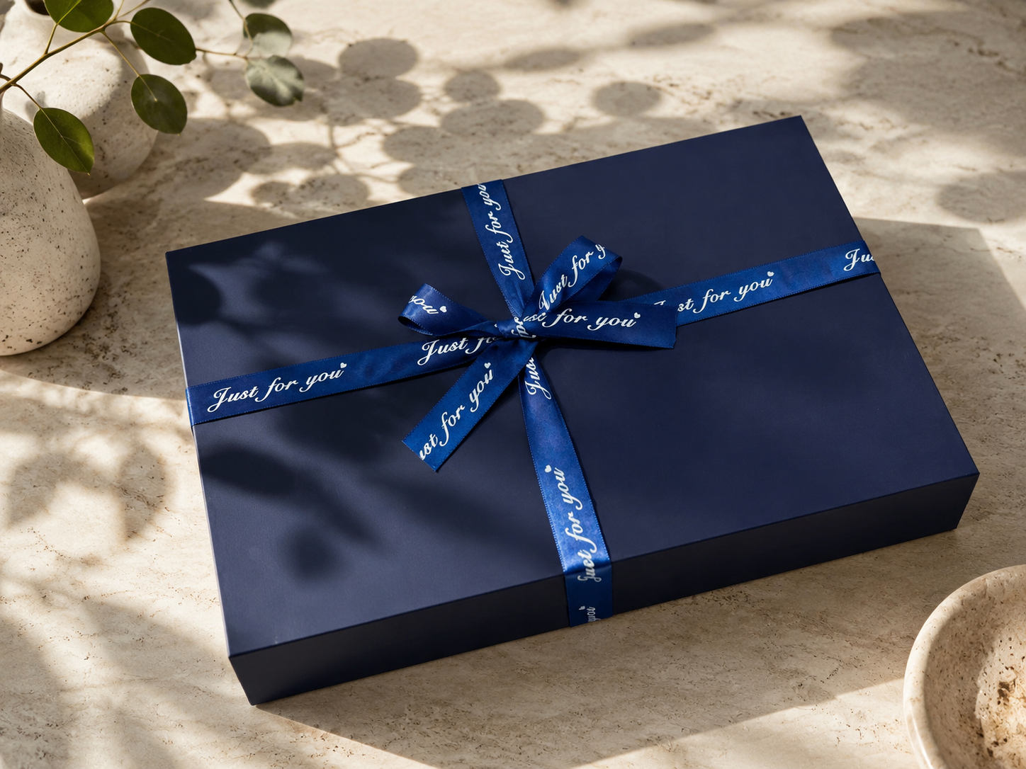 navy-blue-gift-box-satin-ribbon-macro-texture.jpg.png
