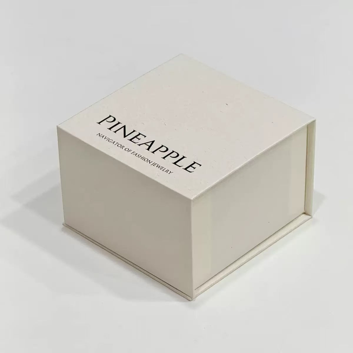Open book-style magnetic gift box showing the lined interior