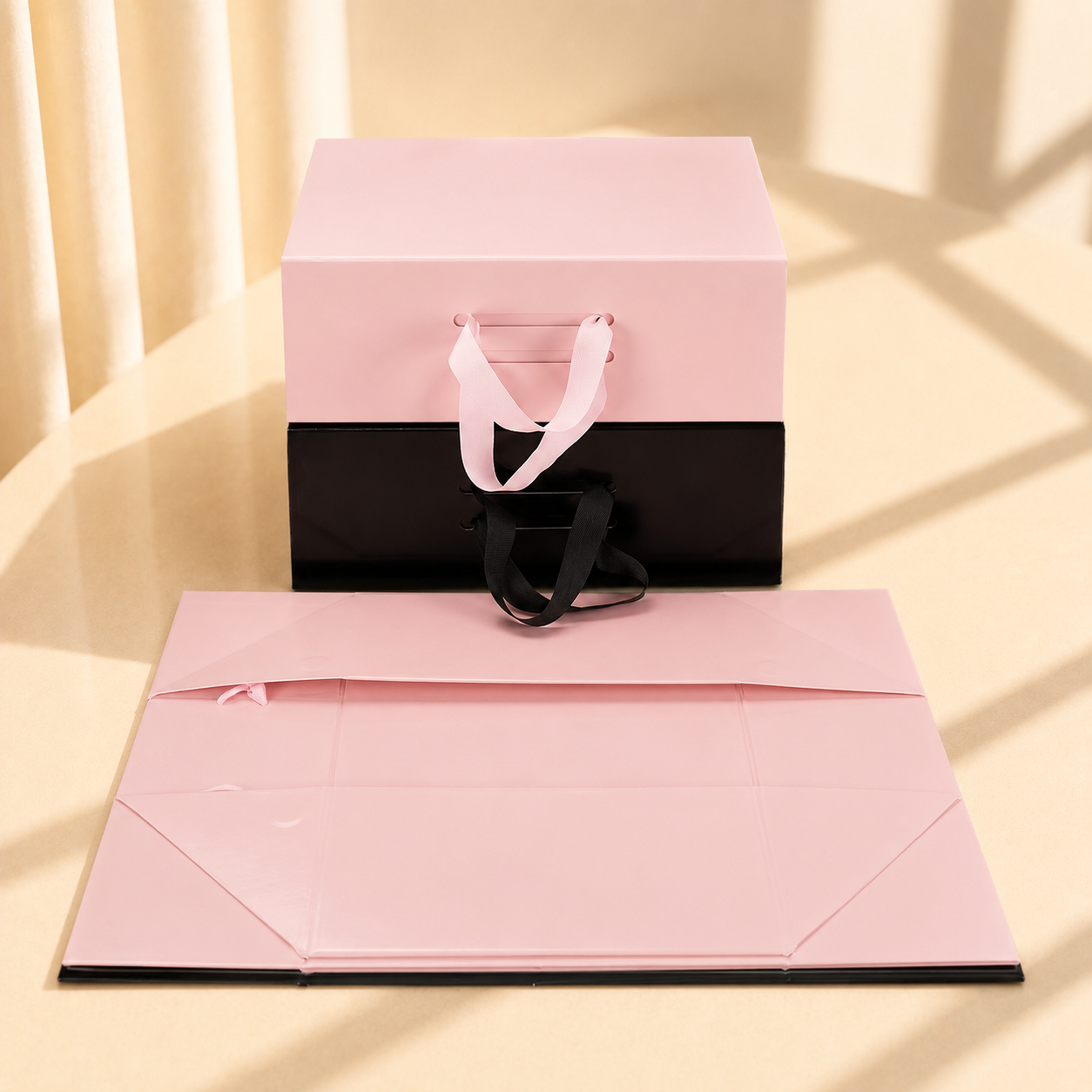 Pink and black handled folding gift boxes with matching flat panels