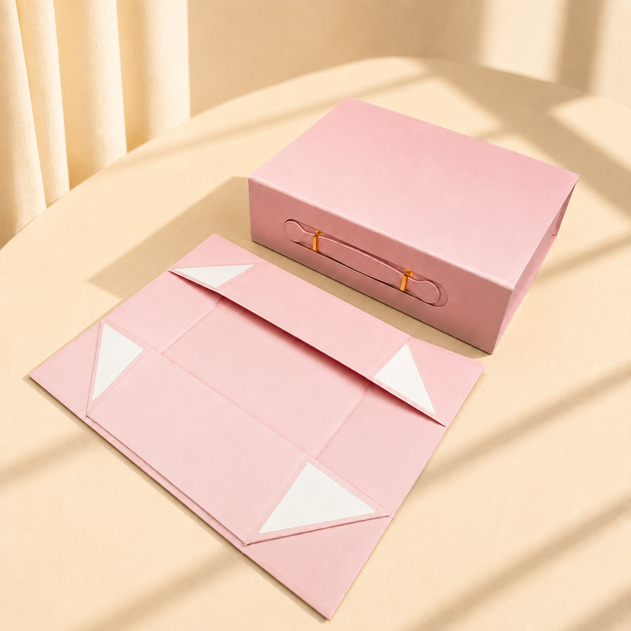 Pink handled folding gift box shown assembled and flat