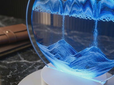 A cinematic, high-definition video background showcasing the mesmerizing liquid motion of a deep blue 3D moving sand art lamp, creating a luxurious and calming atmosphere for modern office decor.