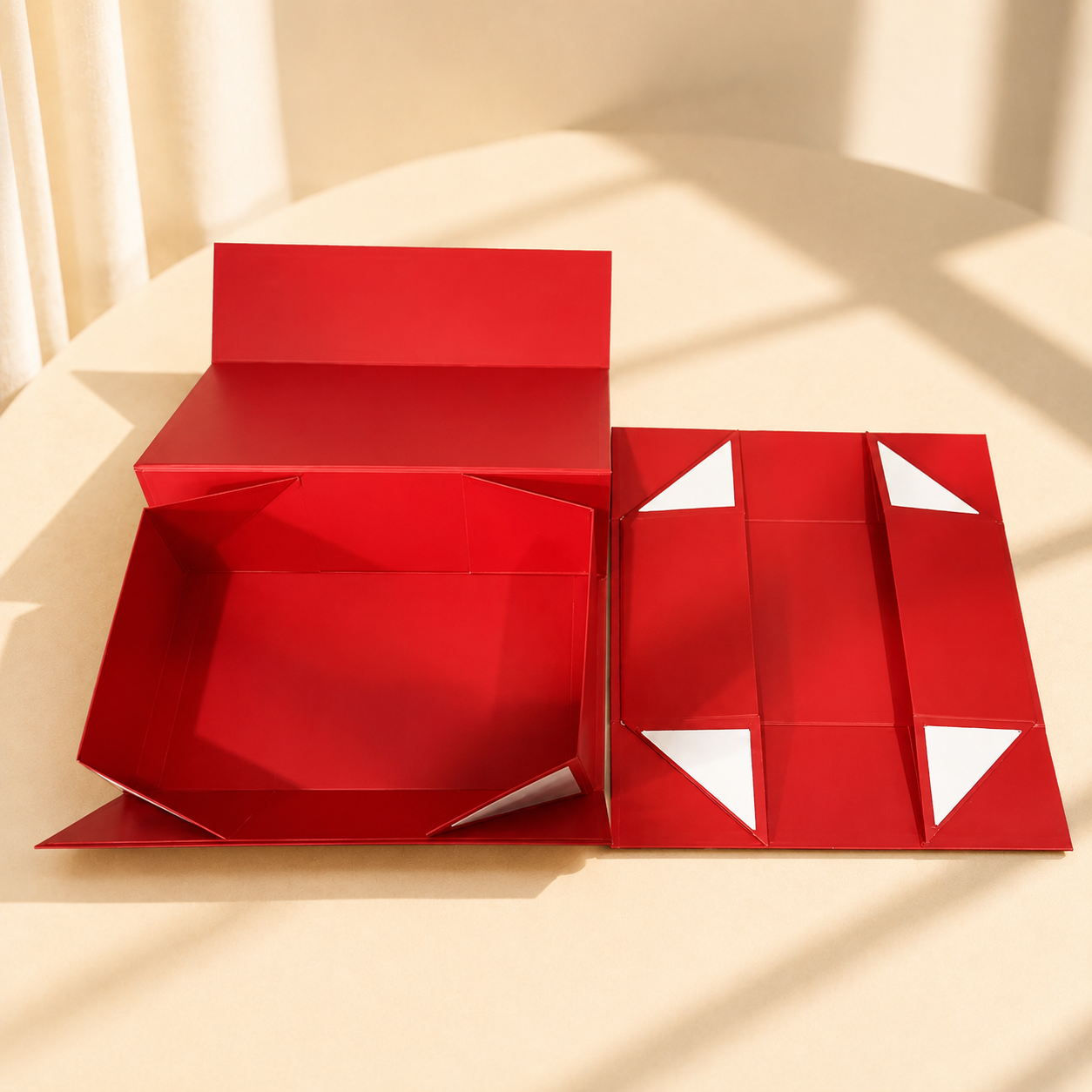 Red collapsible magnetic gift box shown open and flat
