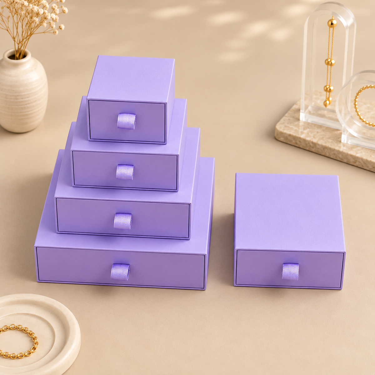 Purple paper drawer jewelry boxes shown in the five size options