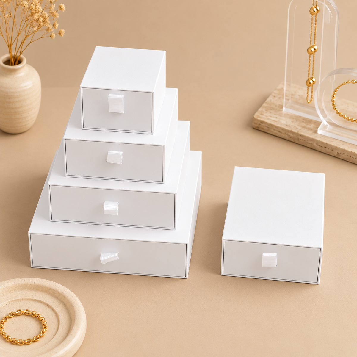 White paper drawer jewelry boxes shown in the five size options