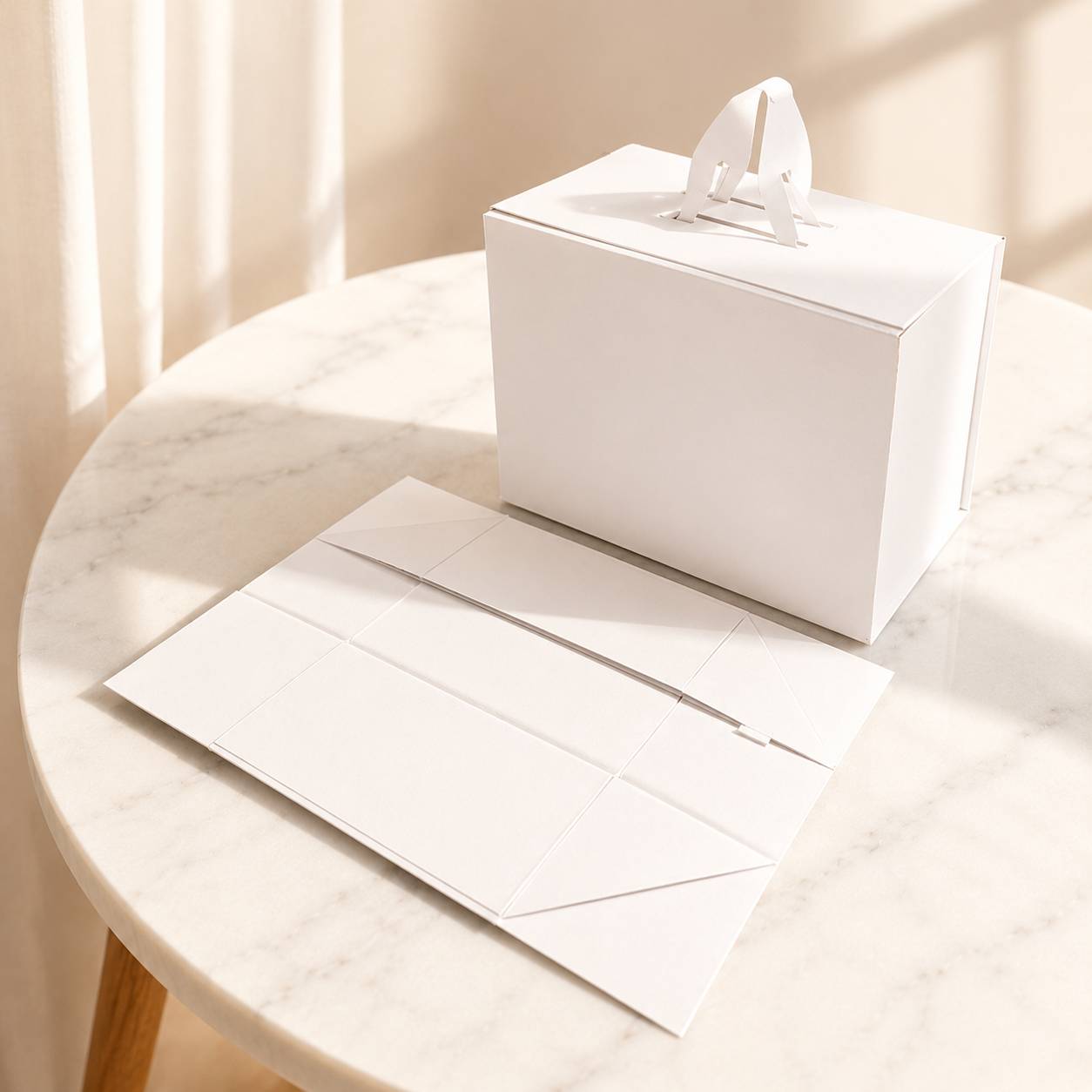 White handled collapsible gift box shown assembled and flat