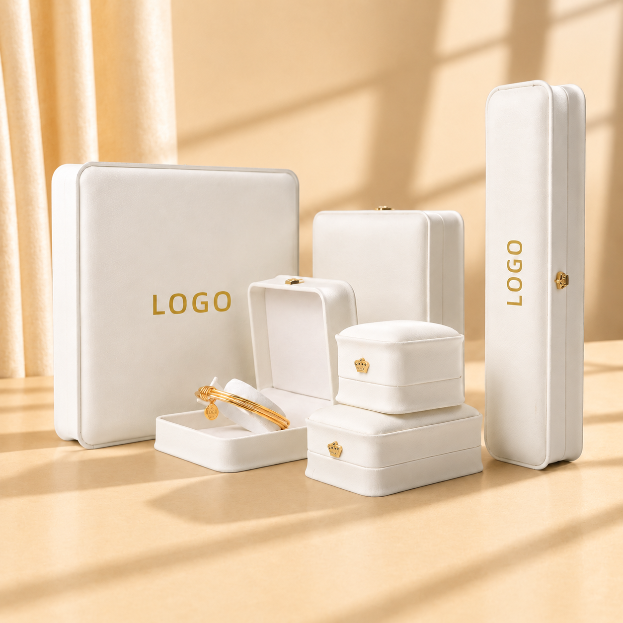 White jewelry gift box set with custom gold logos