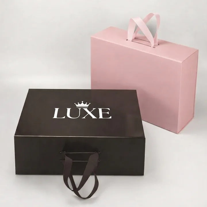 White foil stamped logo on a dark rigid gift box